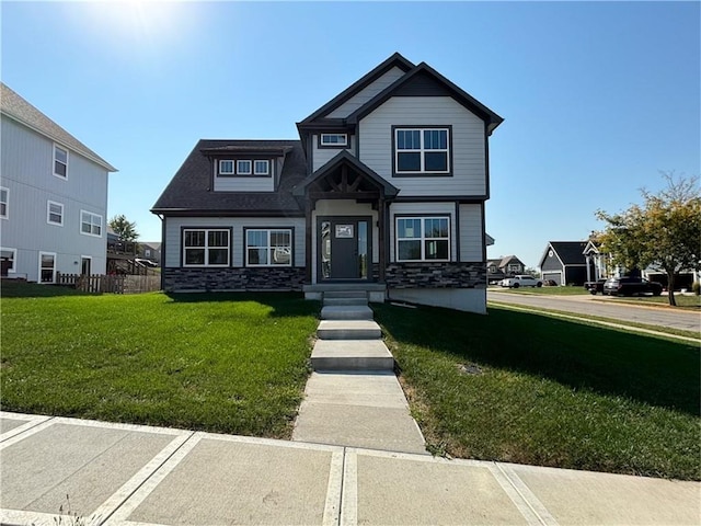 craftsman inspired home with a front yard