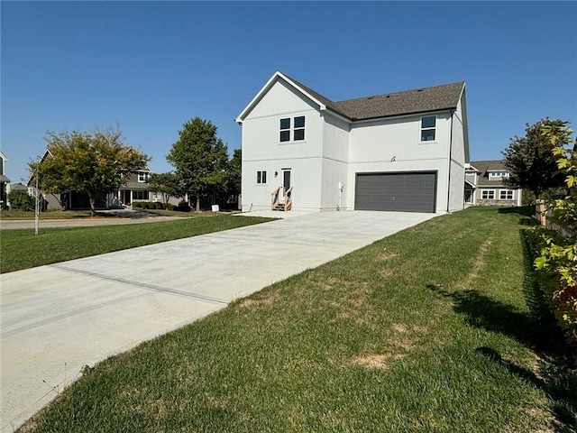 view of front of home with a garage and a front yard