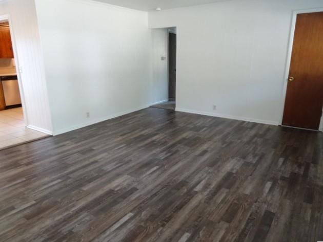 spare room featuring dark hardwood / wood-style flooring