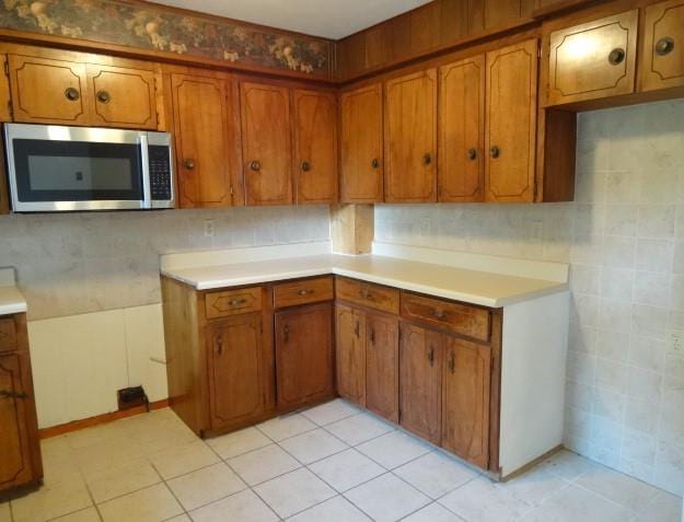 kitchen with tile walls and light tile patterned floors