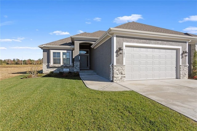 prairie-style home featuring a garage and a front lawn