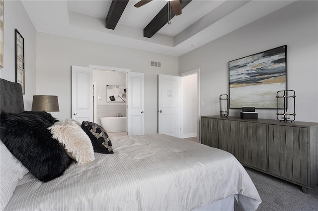 bedroom with ensuite bath, carpet, beam ceiling, and ceiling fan