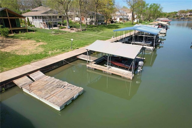 view of dock featuring a yard and a water view