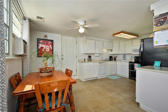 kitchen featuring white cabinets, white appliances, light tile flooring, and ceiling fan