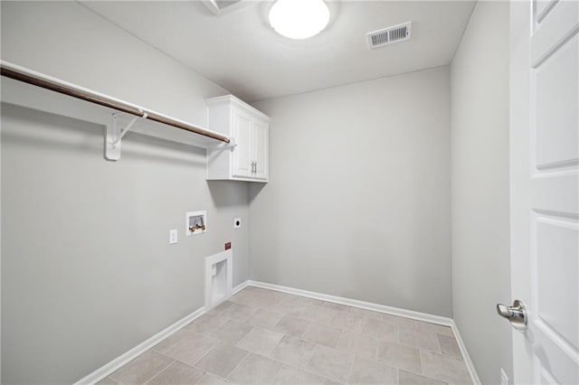 laundry area featuring washer hookup, electric dryer hookup, and cabinets