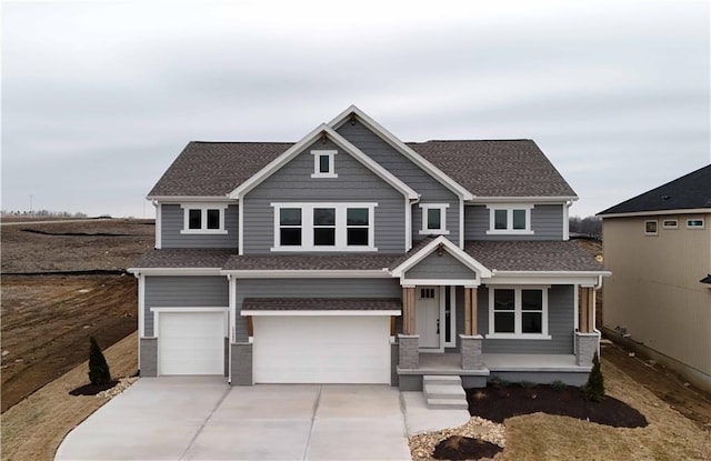 view of front facade featuring a garage and a porch