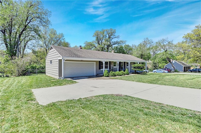 ranch-style house featuring a front yard and a garage