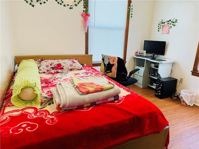 bedroom featuring light wood-type flooring