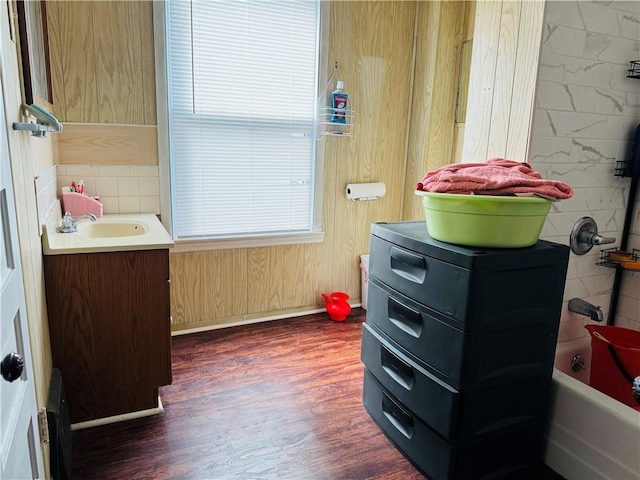 bathroom with  shower combination, vanity, and hardwood / wood-style floors