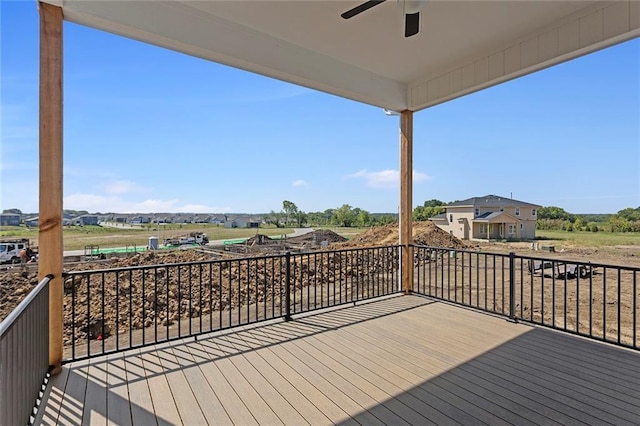 wooden deck with a ceiling fan