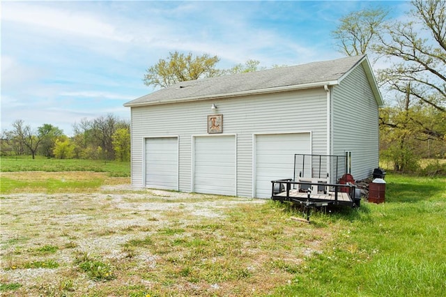 garage with a lawn