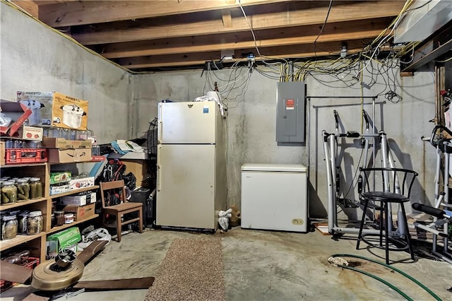 basement with electric panel and white refrigerator