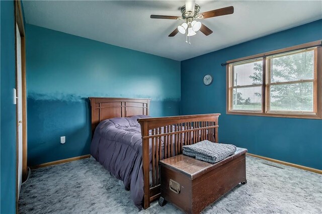 bedroom with ceiling fan and carpet flooring