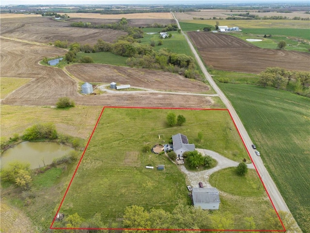 aerial view with a water view and a rural view