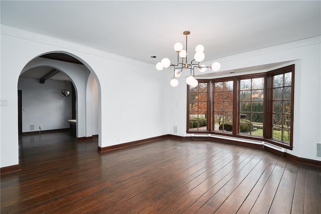 empty room featuring crown molding, dark wood-type flooring, a chandelier, and a healthy amount of sunlight