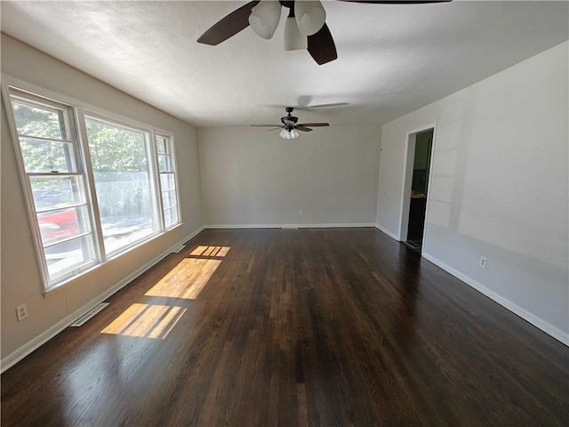 empty room featuring dark wood-type flooring