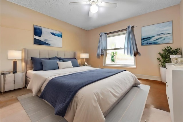 bedroom with hardwood / wood-style flooring and ceiling fan