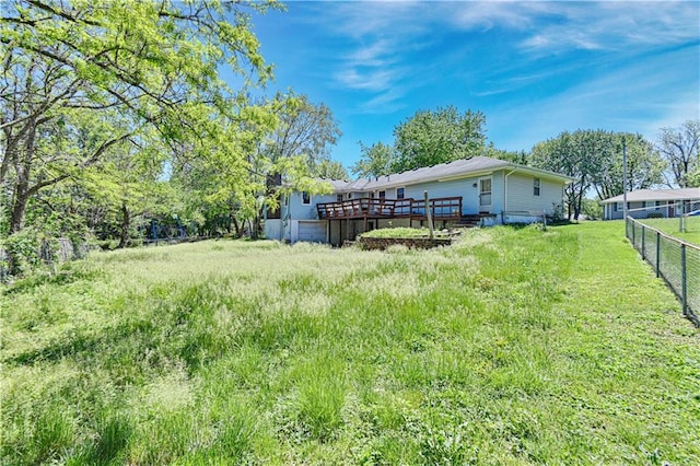 view of yard with a wooden deck