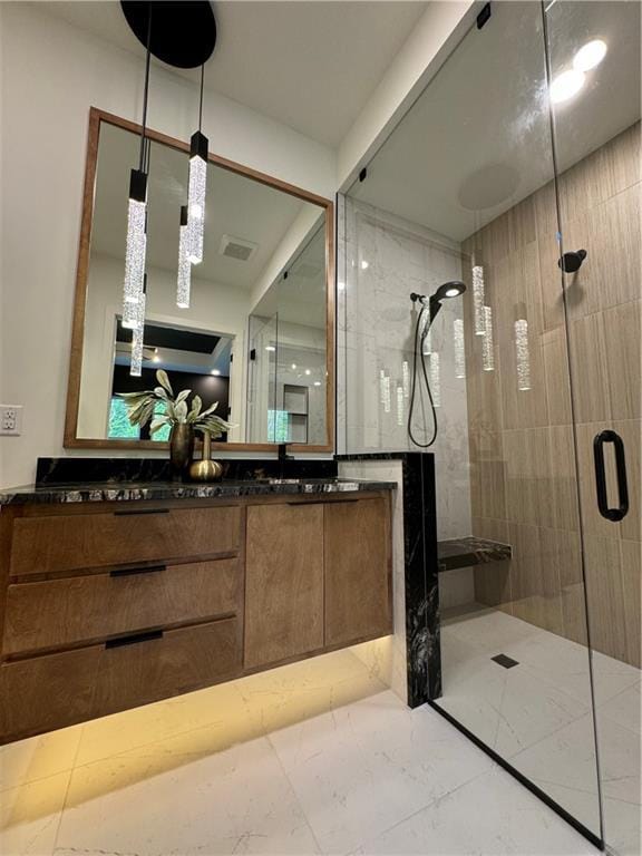 bathroom with vanity and walk in shower