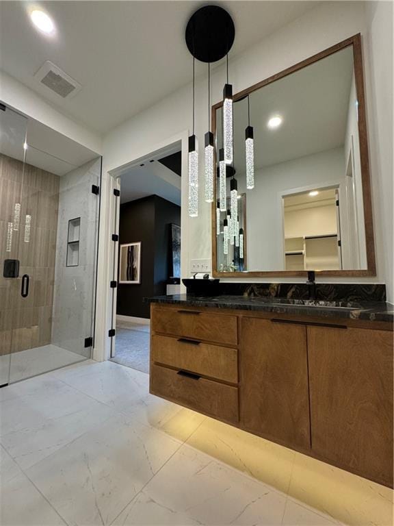 bathroom with vanity and an enclosed shower