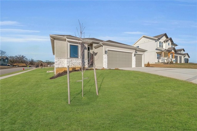 view of front of property featuring a garage and a front lawn