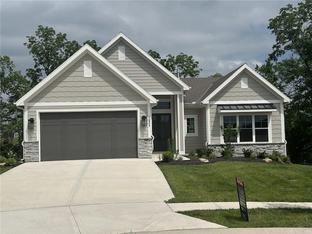 24908 W 98th Pl, Lenexa, KS 66227 - craftsman inspired home featuring stone siding, concrete driveway, a front lawn, and an attached garage
