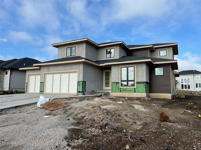 prairie-style home featuring a garage