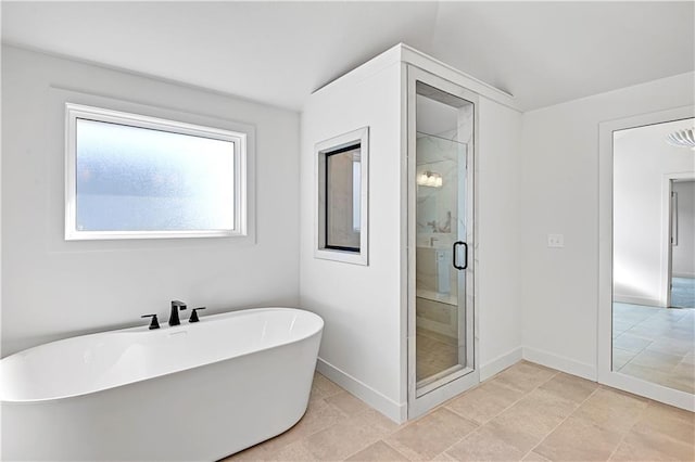 bathroom with shower with separate bathtub