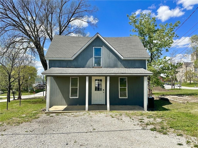 view of front of property with a front yard and a porch