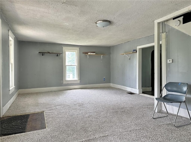 interior space featuring a textured ceiling