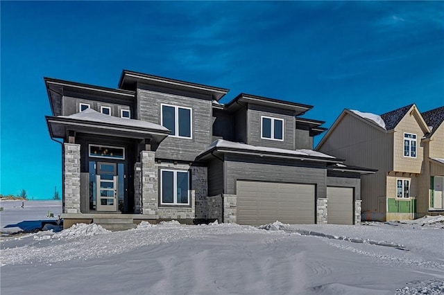 prairie-style house featuring a garage