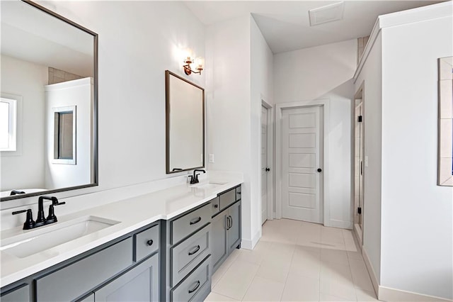 bathroom with vanity, a shower with shower door, and tile patterned flooring