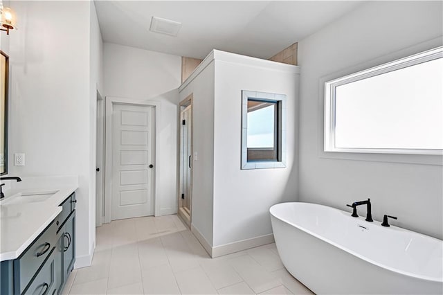 bathroom with vanity and independent shower and bath