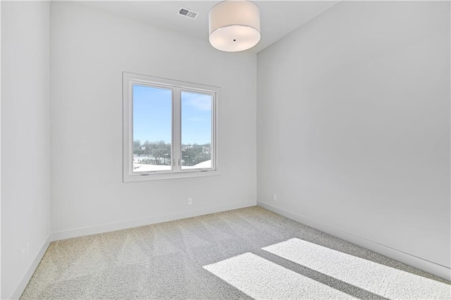 empty room with carpet flooring