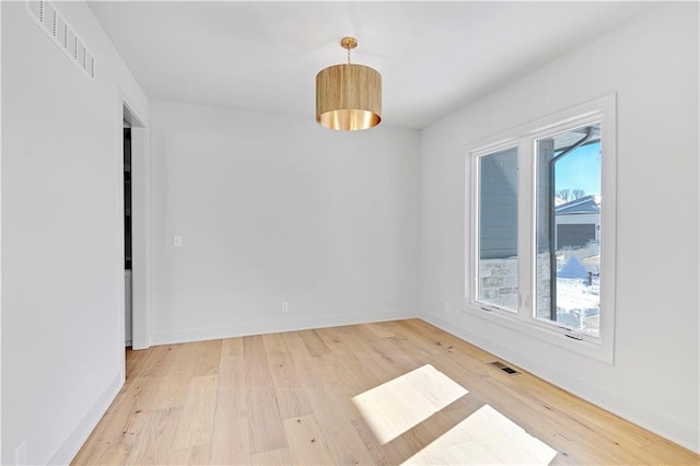 unfurnished room with light hardwood / wood-style floors