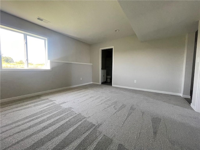 spare room featuring carpet flooring