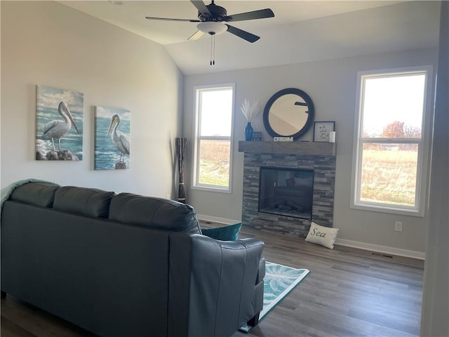 living room featuring ceiling fan, lofted ceiling, and hardwood / wood-style floors