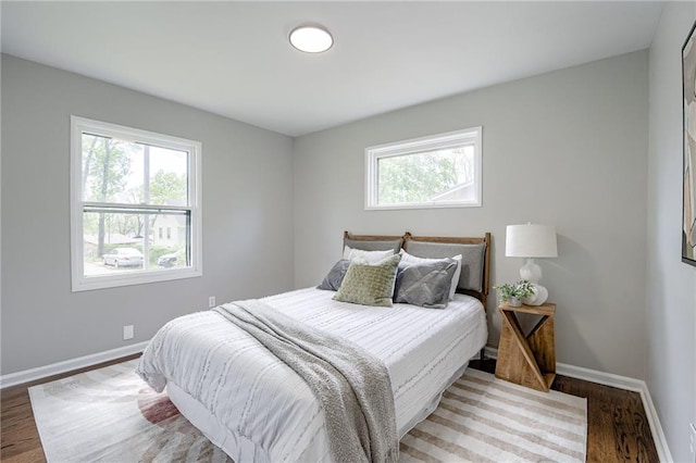 bedroom with hardwood / wood-style floors