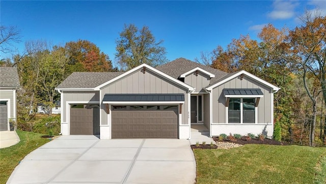 view of front of property with a garage and a front yard