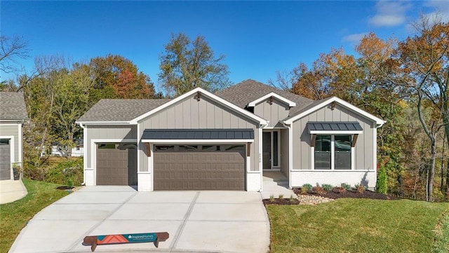 view of front of property with a front lawn and a garage