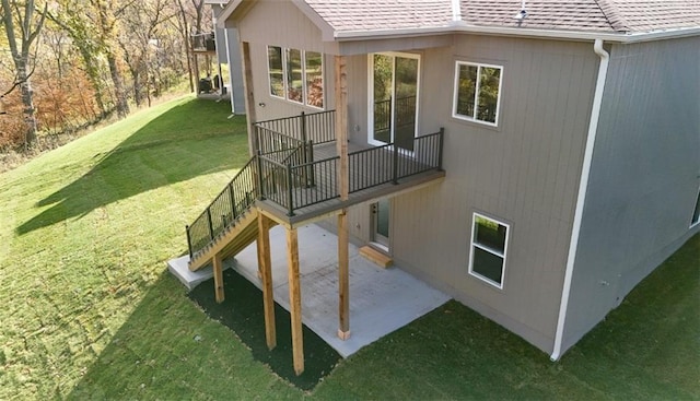 view of home's exterior featuring a lawn and a patio