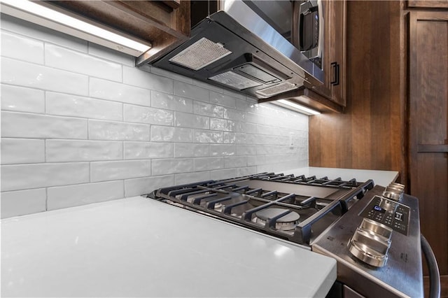 kitchen with backsplash and extractor fan