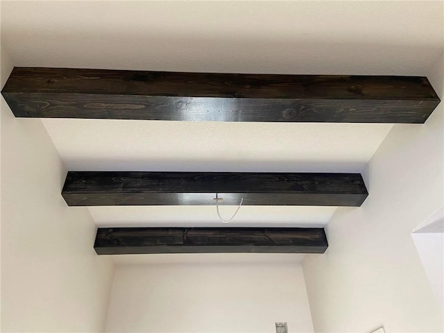 interior details featuring beam ceiling