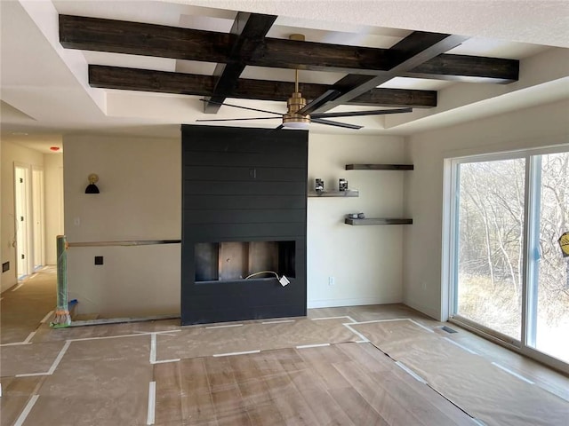 interior space featuring a large fireplace, coffered ceiling, and beam ceiling