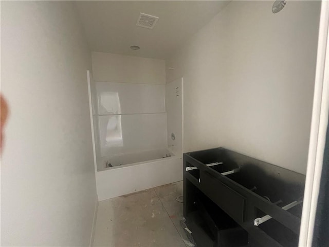 full bath featuring bathtub / shower combination, visible vents, and unfinished concrete flooring