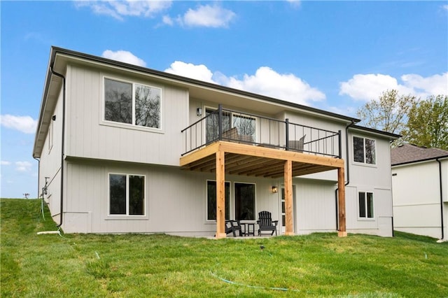back of property featuring a lawn