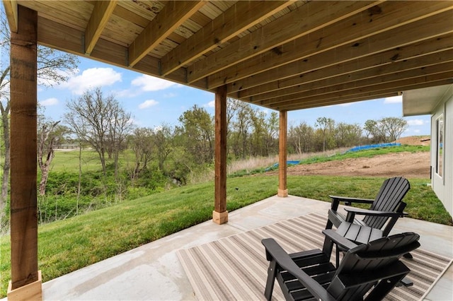 wooden deck featuring a yard and a patio area