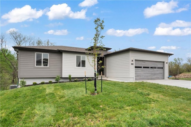 ranch-style house featuring cooling unit, concrete driveway, a front lawn, and a garage