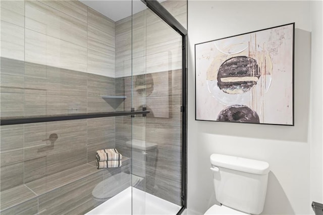 full bathroom with toilet and a shower stall