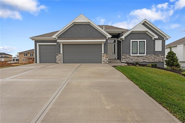 view of front of house with a garage and a front lawn